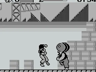 
											The second boss is throwing barrels at you. Just go to the left side of the screen where he can't reach them.