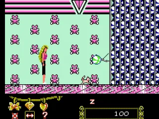 
											The ball dispenser is the miniboss of the mall.  Barbie must give crystals to the cat so the cat will swat at it.  Meanwhile, she has to avoid the balls.