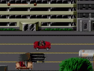 
											Driving sequence. Slater is driving the brown car near the bottom of the screen.