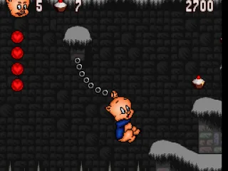 
											Hanging on to a chain to reach the other platforms